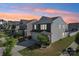 Two-story home with a well-manicured lawn, mature landscaping, gray siding, and a two-car garage at 6878 Spring Peeper Ln, Lancaster, SC 29720