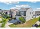 Charming two-story home with a well-manicured lawn, gray siding, and a two-car garage at 6878 Spring Peeper Ln, Lancaster, SC 29720