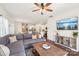 Inviting living room featuring an open layout, hardwood floors, and a large gray sectional at 6878 Spring Peeper Ln, Lancaster, SC 29720