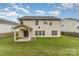 This house boasts a lovely backyard with a covered patio, excellent for entertaining and relaxation at 7031 Woodbridge Valley Cir, Charlotte, NC 28227
