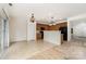 Kitchen with wood cabinets, modern appliances, tile floor, and breakfast bar at 7031 Woodbridge Valley Cir, Charlotte, NC 28227