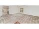 Open living room with plush carpeting and large window allowing plenty of natural light at 7031 Woodbridge Valley Cir, Charlotte, NC 28227