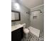 Modern bathroom with patterned floor tile and a glass shower at 715 Larimer Ln, Charlotte, NC 28262