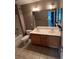Bathroom features double sink vanity, tile floor and combination tub and shower at 715 Larimer Ln, Charlotte, NC 28262