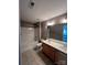 Bright bathroom with double vanity sinks and combination tub and shower at 715 Larimer Ln, Charlotte, NC 28262