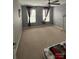 Bedroom features two windows with patterned curtains and carpet flooring at 715 Larimer Ln, Charlotte, NC 28262