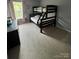 Cozy bedroom showcases a black bunk bed and a window at 715 Larimer Ln, Charlotte, NC 28262