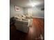 Bright bedroom featuring neutral carpet, soft natural light and ensuite bathroom at 715 Larimer Ln, Charlotte, NC 28262