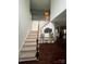 Elegant foyer with hardwood floors, a staircase, and decorative accents at 715 Larimer Ln, Charlotte, NC 28262