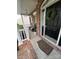 Inviting front porch with brick accents, a welcoming wreath, and outdoor seating at 715 Larimer Ln, Charlotte, NC 28262
