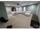 This neutral living room is complete with a large couch and carpeted floors at 715 Larimer Ln, Charlotte, NC 28262