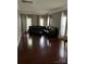 Large living room features a leather sectional, hardwood floors and lots of natural light at 715 Larimer Ln, Charlotte, NC 28262