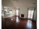 Open-concept living room with fireplace and large windows at 715 Larimer Ln, Charlotte, NC 28262