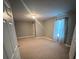 A living room boasts hardwood floors, neutral paint and a comfortable seating arrangement at 715 Larimer Ln, Charlotte, NC 28262