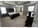 Main bedroom features a ceiling fan and gray walls at 715 Larimer Ln, Charlotte, NC 28262