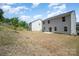 Spacious backyard with trees and potential for custom landscape design at 725 Pointe Andrews Dr, Concord, NC 28025