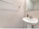 Small bathroom with pedestal sink and silver towel rack at 725 Pointe Andrews Dr, Concord, NC 28025