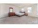 Spacious bedroom featuring an ample layout, natural light, and coordinated furniture at 725 Pointe Andrews Dr, Concord, NC 28025