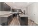 Gorgeous kitchen showcasing gray cabinets and stainless steel appliances at 725 Pointe Andrews Dr, Concord, NC 28025