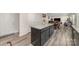 Open floor plan showing kitchen with island, plus view to living area at 725 Pointe Andrews Dr, Concord, NC 28025