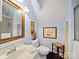 Comfortable bathroom with simple vanity, toilet, and patterned shower curtains at 8017 Nathanael Greene Ln, Charlotte, NC 28227