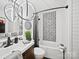 Modern bathroom features a sleek vanity, updated fixtures, and a tiled shower at 8017 Nathanael Greene Ln, Charlotte, NC 28227