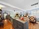 Open-concept kitchen and living space features a central island, hardwood floors, and modern finishes, ideal for entertaining at 8017 Nathanael Greene Ln, Charlotte, NC 28227