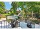Backyard featuring a spacious deck with above ground pool and lush landscaping at 8056 Stevens Mill Rd, Matthews, NC 28104