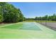Community basketball court surrounded by trees at 8056 Stevens Mill Rd, Matthews, NC 28104