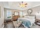 Comfortable main bedroom featuring vaulted ceilings, a ceiling fan, a cozy bed, and hardwood floors at 8056 Stevens Mill Rd, Matthews, NC 28104