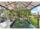 Covered outdoor dining area with ample seating and a picturesque view of the surrounding landscape at 8056 Stevens Mill Rd, Matthews, NC 28104