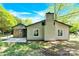 The backyard features a concrete patio, partial brick wall, and vinyl siding at 8303 Hemby Wood Dr, Indian Trail, NC 28079