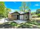 Backyard area with patio, chain link fence, and brick and siding exterior at 8303 Hemby Wood Dr, Indian Trail, NC 28079