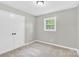 Bright bedroom boasts a large window and ample closet space, perfect for relaxing or getting ready at 8303 Hemby Wood Dr, Indian Trail, NC 28079