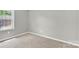 Cozy bedroom featuring plush carpet, neutral walls, and a bright window at 8303 Hemby Wood Dr, Indian Trail, NC 28079