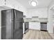 Well-equipped kitchen featuring white cabinets, stainless steel appliances, and durable countertops at 8303 Hemby Wood Dr, Indian Trail, NC 28079