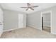 Spacious living area with neutral tones, a ceiling fan, and tile floors in some areas at 8303 Hemby Wood Dr, Indian Trail, NC 28079
