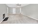 Spacious living room with plush carpeting, neutral walls, fireplace, and a ceiling fan at 8303 Hemby Wood Dr, Indian Trail, NC 28079