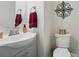 Bathroom with stylish vanity, decorative mirror, and modern fixtures at 9204 Washam Potts Rd, Cornelius, NC 28031