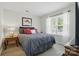 Cozy bedroom featuring natural light, a comfortable queen-sized bed, and stylish decor at 9204 Washam Potts Rd, Cornelius, NC 28031