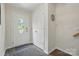 Bright entryway with hardwood floors, closet space, and a welcoming front door at 9204 Washam Potts Rd, Cornelius, NC 28031