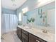 Bathroom features double vanity with great lighting, and a shower tub combo with privacy curtain at 938 Rock Forest Way, Fort Mill, SC 29707