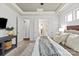 Beautiful primary bedroom with trey ceiling, large windows, and access to an ensuite bathroom at 938 Rock Forest Way, Fort Mill, SC 29707