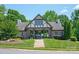 Charming brick clubhouse with a covered entrance, landscaped lawn, and paved walkway at 938 Rock Forest Way, Fort Mill, SC 29707