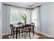 Cozy dining area featuring natural light, modern decor, and seating for four with hardwood floors at 938 Rock Forest Way, Fort Mill, SC 29707