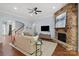 Inviting living room features a stone fireplace, hardwood floors, and comfortable seating at 938 Rock Forest Way, Fort Mill, SC 29707