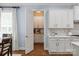 Walk-in pantry offers plenty of storage with white cabinets and wooden countertops near the kitchen at 938 Rock Forest Way, Fort Mill, SC 29707