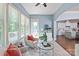 Sunroom with views of the kitchen, and multiple windows providing natural light, creating a seamless flow at 938 Rock Forest Way, Fort Mill, SC 29707