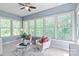 Bright sunroom with multiple windows providing natural light and relaxing space with seating arrangements at 938 Rock Forest Way, Fort Mill, SC 29707