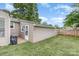 The house has a well-kept lawn, a privacy fence, and a shed for extra storage at 1005 N Main St, Mount Holly, NC 28120
